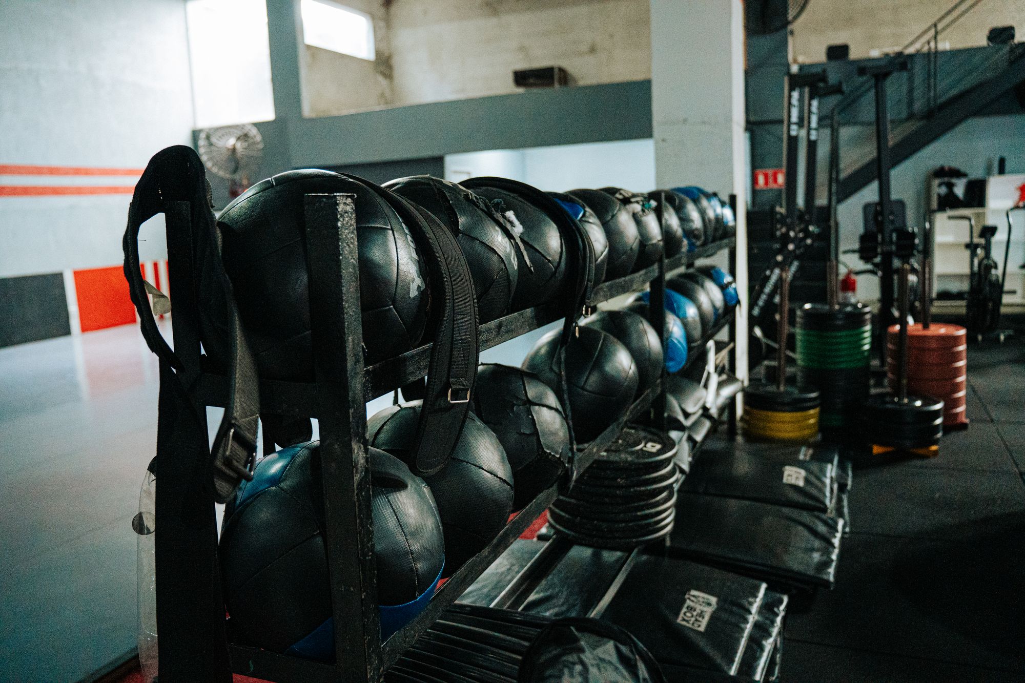 Kettlebells and functional training equipment arranged inside a gym